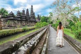 This temple is usually visited by tourist once having a set tour to tanah lot temple due to this temple is the same route of the tanah lot temple tour. Asian Girl Standing Front Of The Gate Of Pura Taman Ayun Temple In Bali Indonesia Editorial Image Image Of Girl Temple 132212890