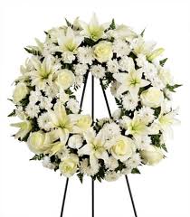 Blue & white mixed half casket cover delivered by a local florist to a funeral home or residence. Funeral Flowers The Meaning Of Colors