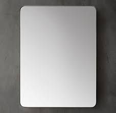 A sleek, contemporary design, this rounded rectangular mirror is ideal over a bathroom vanity but can also serve as an accent piece in an entryway, bedroom, or living room. Bath Mirrors Rh