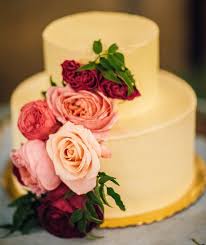 Draping gracefully as it encircles each tier, lush pink, white, and purple icing roses accent and complement the decorative trim. Small Wedding Cakes Everyone Will Love Inside Weddings