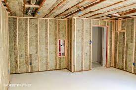 Although you can add a new wall to a house by framing it and raising it into position, the irregularity of a typical basement makes it more efficient to use the stick build method. Insulating And Framing A Basement