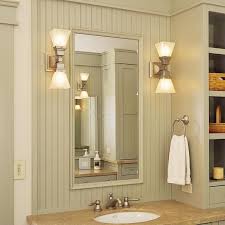 If the sconces have shades, put the bottom edges of the shades a little below eye level (60 to 68 inches from the floor). Two Light Linear Sconce With 2 1 4 Shade Holders Bathroom Mirror Lights Bathroom Sconces Interior Lighting