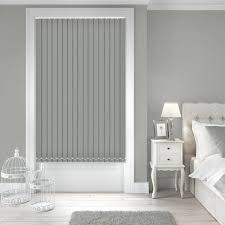 Vertical blinds, window with vertical blinds and light, image for decor. Vitsy Metro Medium Grey Blackout Vertical Blinds