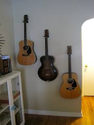 Hanging Guitars On Art Wall Trio Of Guitars Nice Guitars Wall Decor Hanging Guitars Art Wall Home Decor