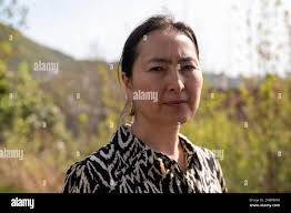 Uyghur Mihrigul Musa poses for a photo in her yard in Bergen, Norway,