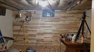 A concrete block foundation can be stronger than a poured concrete foundation. Cement Block Wall Pallet Wood Covering Diy Youtube