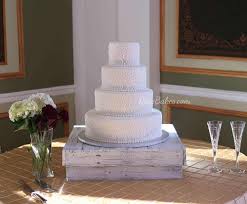 All White Scrollwork Wedding Cake