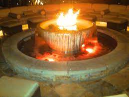 Finished with a brown, earthy color, its Fire Bowl Fountain Outdoor Gas Fireplace Fire Features Hot Tub Landscaping