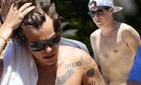 The question is, do you think its real? Shirtless Niall Horan Shows Off His Tattoo Free Torso As Inked Up Harry Styles Denies Claims Of One Direction Split After Solo Song Leaks Daily Mail Online