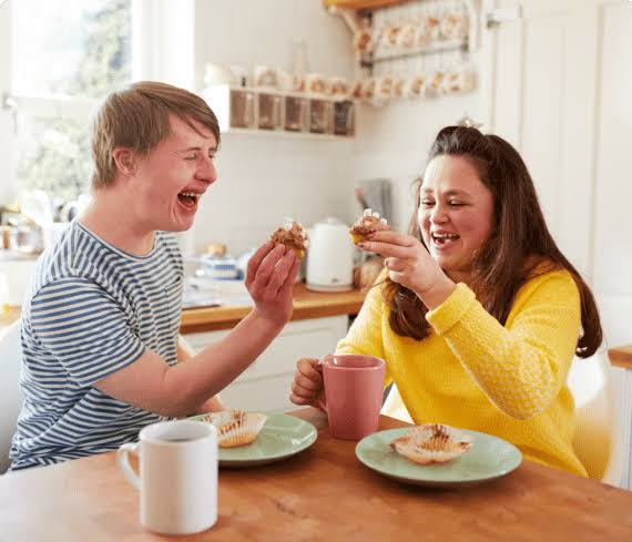 A support worker helping an individual work toward personal goals