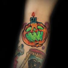 This tattoo is a great inspiration for the wearer. 17 Jack O Lantern Tattoos For Halloween Fun Ideas Entertainmentmesh