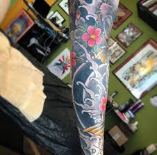 Professional tattooist hold machine in hand at work. Fraternity Tattoo Parlour Tubingen Fraternitytattoo