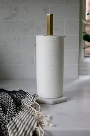 Bring elegance and sophistication to your kitchen with this black marble paper towel holder! Ferm Living Hex Marble And Brass Kitchen Roll Holder Kitchen Roll Holder Kitchen Roll Brass Kitchen Accessories