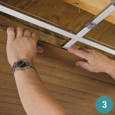 Attach Ceiling Planks To An Exisitng Drop Ceiling Grid With Special Clips For A Fresh Wood Look Ceiling Dropped Ceiling Basement Ceiling Drop Ceiling Tiles
