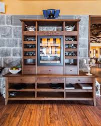 A kitchen is a great place for a glass cabinet if you have a lot of space in the kitchen or feel like many of the items you want to display are better suited here. 71 Awesome Home Bar Ideas