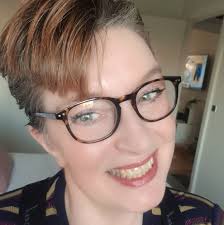 The green (lucky) keeps looking down like he's depressed. They have a bunch  of toys, food and water. What could be his issue? Idk if he's just tired  but he hasn't moved