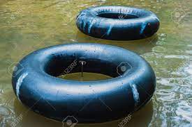Product title 9 x 6 ft floating water mat foam pad lake floats lil. Old Inner Tubes Floating On A River Selective Focus Stock Photo Picture And Royalty Free Image Image 58781883