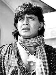 This image is a throwback family photograph of the Indian actor Mithun  Chakraborty with his wife, the former actress Yogita Bali, and their  children. The people in the photo are: Mithun Chakraborty: