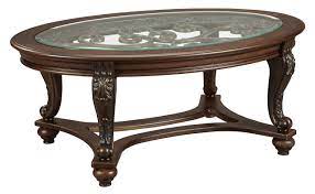 It features a sleek, steel framework in. Signature Design By Ashley Norcastle Traditional Glass Top Oval Coffee Table Dark Brown Buy Online In Angola At Angola Desertcart Com Productid 19761758