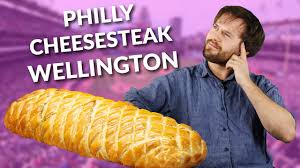 Thinly sliced and fried ribeye steak, cheese, onions, and a delicious. How To Make A Philly Cheesesteak Wellington With Hugh Cooking With