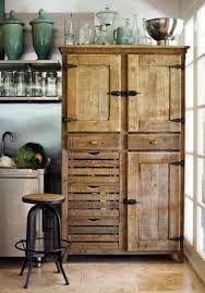 A Kitchen Cabinet Which Is Made Up Of Scrap Wood Reclaimed From Doors And Windows Gives A Very Different R Beautiful Furniture Rustic Furniture Pantry Cupboard