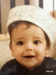 Please help clean up picture of my son. The lighting was low and so we're  the pixels.