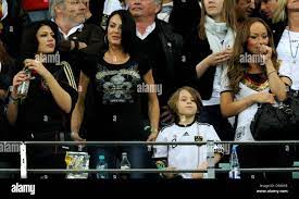 Sherin Senler (L-R), girlfriend of Jerome Boateng, Anna Maria Lagerblom,  girlfriend of Mesut Oezil and Melanie Tiburtius, girlfriend of Piotr  Trochowski on the stand prior to the 2010 FIFA World Cup semi-final