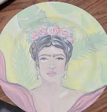 Kalabougou woman applying a red stone slip for glazing, from an art market,  to the formed and dried pot before firing. 🤎🤎🖤🖤