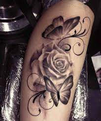 White Rose With Butterflies Tattoo Ideas Tattoo Designs Rose And Butterfly Tattoo Butterflies Tattoo Trendy Tattoos
