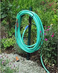 Make your faucet easier to reach! Amazon Com Yard Butler 100049499 Hose Hanger With Faucet Green Garden Hose Parts Garden Outdoor