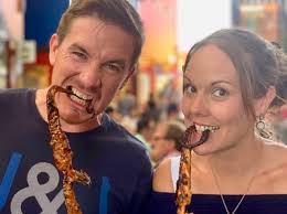 Colin McAllister & Laura Leicester both tackle the large Octopus Tentacle  at "The Little Octopus" in the LaneWay.