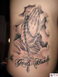 A beaded garland is entangled around it and a cross is hanging from the garland. Pin On God Is Love Craft
