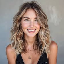 Who can help me achieve dark ash blonde hair with face framing highlights?