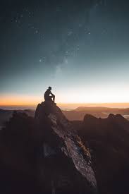 Silhouette Of Person Sitting On Rock Formation During Golden Hour Photo Free Nature Image On Unsplash Mountain Wallpaper Landscape Wallpaper Silhouette Man