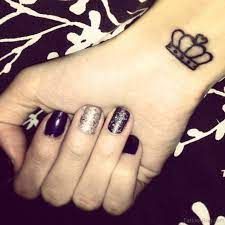 Black stars and crown tattoo on right wrist. 48 King And Queen Tattoos For Wrist