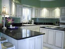 White Cabinets With Black Granite Countertops Jpg 500 375 White Kitchen Paint Best Kitchen Countertops Kitchen Countertops White Cabinets