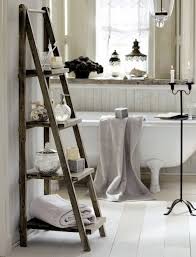 If you love reclaimed furniture, you'll adore this upcycled stepladder side table that only uses a step ladder and a few pallet wood boards! Diy Ladder Shelf Ideas Easy Ways To Reuse An Old Ladder At Home