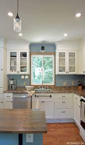 And when you're doing that over the sink it's important to still start at the countertop, not the bottom of the sink. Install A Sconce Light Above The Kitchen Sink