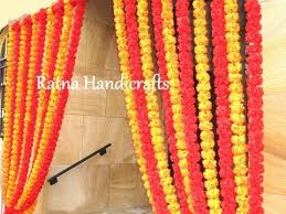 This rose bush can go in a vase by itself or can be combined with other artificial flowers and greenery to create a beautiful arrangement or centerpiece. Artificial Marigold Flower Garlands Manufacturer Exporter Ratna Handicrafts Marigold Flower Silk Flowers Flower Garlands
