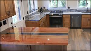 Applying a second coat of epoxy. Epoxy River Table