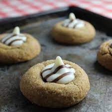 Topped with heath toffee bits and hershey's special dark chocolate, it's a decadent holiday cookie. White Chocolate Kissed Gingerbread Thumprint Cookies Group Pan 2 Ginger Cookies Thumbprint Cookies Hershey Kiss Thumbprint Cookies