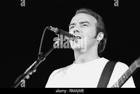 Scottish guitarist, singer, songwriter and keyboard player James "Midge"  Ure is shown performing