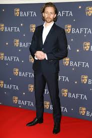 Jeff spicer / getty images. Tom Hiddleston Fashion Bafta Film Gala 2019