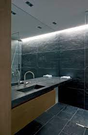 This type of large bathroom mirror that covers the whole one side of the wall is really hypnotizing. Bathroom Mirror Ideas Fill The Whole Wall