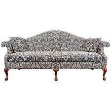 The camelback couch was the original thomas chippendale, named for sti elegant sloping back that's high in the middle, then a drops to the same height as its subtly rolled arms. Camel Back Sofa With Ball And Claw Feet Upholstered In A Colonial Style Print At 1stdibs