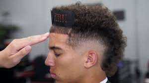 The mohawk haircut design trend has hit the hair industry by storm and barbers who are specializing in mohawk cuts have made a name for themselves by introducing unique mohawk hairstyles. Haircut Tutorial Burst Fade Mohawk Design Youtube