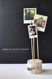 Use your kid's rock collection or shells. Futurist Architecture Diy Photo Holder Diy Holder Photo Holders