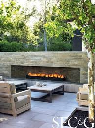 andrea cochran coaxes the grounds of an atherton property into a sublime formal garden cottages gardens backyard fireplace modern outdoor fireplace patio design