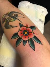 Filler pinwheel flower done by Kevin Dickson at Haight-Ashbury Tattoo, San  Francisco : r/traditionaltattoos