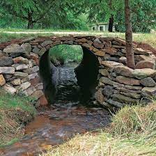 How To Build A Stone Culvert Mother Earth News Driveway Landscape Landscape Garden Bridge